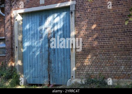 Locked metal gates in the sun Stock Photo
