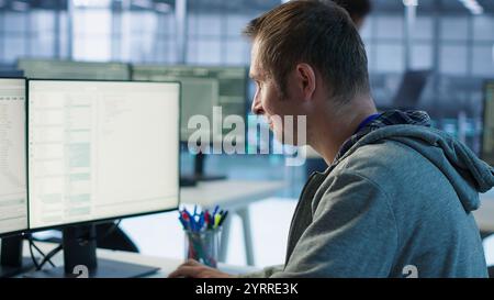 System administrator in server room doing system analysis, coding supercomputers. Specialist working in high tech facility housing advanced storage infrastructure, camera A close up Stock Photo