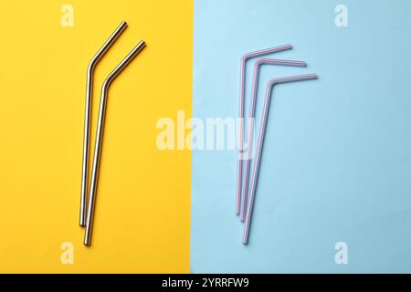 Different drinking straws on color background, flat lay Stock Photo