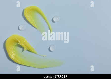 Different cosmetic products on light blue background, top view. Space for text Stock Photo