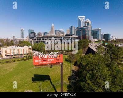 APRIL 1, 2022, CHARLOTTE, NC, USA - Aerial View of Charlotte, North Carolina on clear day showing highways and skyline shows classic Coca Cola red billboard Stock Photo