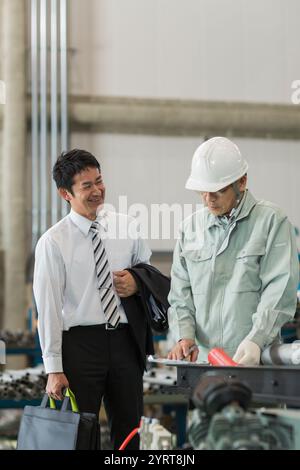 Workers and business people having a meeting Man Stock Photo