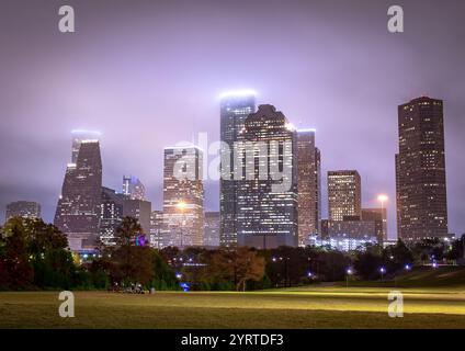 Houston Texas downtown city skyline illuminated buildings. Photo taken on a cloudy foggy evening Stock Photo