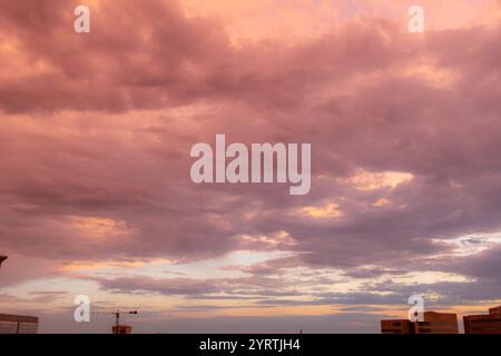 Pink and orange dramatic and colorful sunset. Photo was taken of the sky at golden hour after a rainstorm. Photo was taken in San Antonio Texas. Stock Photo