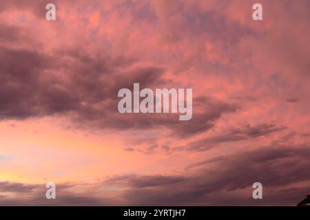 Pink and orange dramatic and colorful sunset. Photo was taken of the sky at golden hour after a rainstorm. Photo was taken in San Antonio Texas. Stock Photo