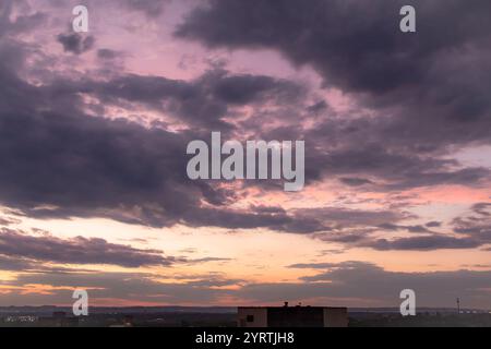 Pink and orange dramatic and colorful sunset. Photo was taken of the sky at golden hour after a rainstorm. Photo was taken in San Antonio Texas. Stock Photo