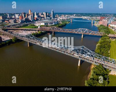 aerial view of Suspension Bridges and James Roebling Bridge crossing Ohio River from Covington Kentucky to Cincinnati Ohio Stock Photo