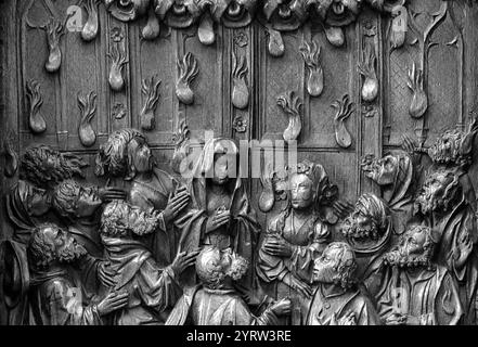 Choirstall woodcarving of the Pentecost, with tongues of fire descending upon the apostles, detail Stock Photo