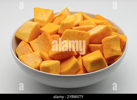 Freshly Cut Pumpkin Cubes in a White Bowl. Stock Photo