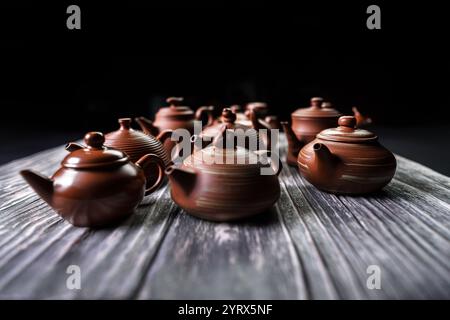 An Elegant Collection of Exquisite Traditional Teapots Beautifully Displayed on a Wooden Table Stock Photo