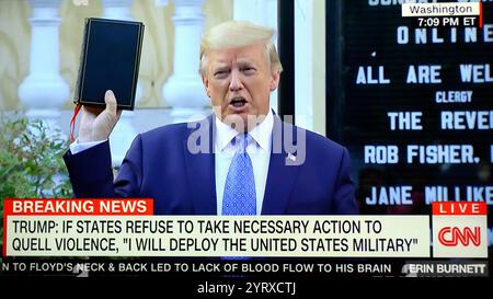 US media coverage: On June 1, 2020, amid the George Floyd protests in Washington, D.C., police and National Guard troops used tear gas and other riot control tactics to forcefully clear peaceful protesters from Lafayette Square and surrounding streets, creating a path for President Donald Trump and senior administration officials to walk from the White House to St. John's Episcopal Church. Trump held up a Bible and posed for a photo op in front of Ashburton House (the church's parish house), which had been damaged by a fire during protests the night before Stock Photo