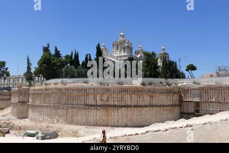 The Holy Trinity Cathedral, (Russian Orthodox Church in Jerusalem), was built in 1860 - 1872 by an Palestinian, Russian-Orthodox institute that operated in Jerusalem, under the Ottoman Empire government. The structure was designed by the architect Martin Eppinger, as a basilica with two aisles, and rounded chambers in the side, which makes the cathedral cross-shaped. The cathedral is built from white stone. During the first Arab-Israeli war, the temple was badly damaged. From 1948 it is in the jurisdiction of the Russian Orthodox Church Stock Photo