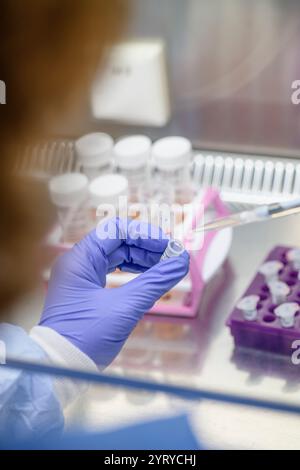Scientist using a pipette to handle samples in a laboratory, emphasizing research, precision, and biotechnology. Stock Photo
