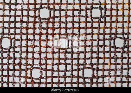 Rusty and damaged metal mesh creating a textured background, highlighting decay and deterioration Stock Photo