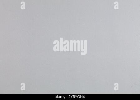 Background of gray evenly textured paper wallpaper. Gray plastered wall. Stock Photo