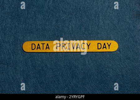 Data privacy day message written on yellow wooden stick with gray background. Conceptual data privacy day symbol. Copy space. Stock Photo