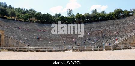 The Ancient Theatre of Epidaurus is a theatre in the Greek city of Epidaurus, located on the southeast end of the sanctuary dedicated to the ancient Greek God of medicine, Asclepius. It is built on the west side of Cynortion Mountain, near modern Lygourio, and belongs to the Epidaurus Municipality. Constructed in late 4th century BC Stock Photo