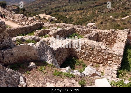 Bronze Age citadel of Mycenae in southern Greece. Mycenae was built with an enclosed acropolis within fortified walls. The fortification was extended during the 13th century BC. represents one of the significant characteristics of the early phase of the Mycenaean civilization. Stock Photo