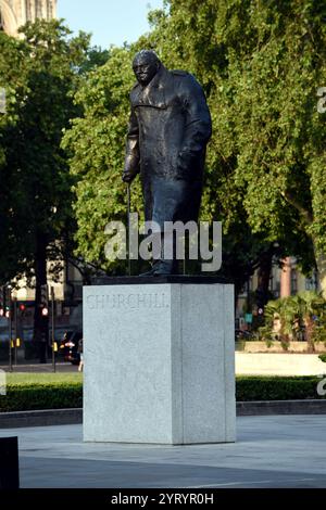 The statue of Winston Churchill in Parliament Square, London, is a bronze sculpture of the former British prime minister Winston Churchill, created by Ivor Roberts-Jones. It is located on a spot referred to in the 1950s by Churchill as 'where my statue will go'. It was unveiled in 1973 by his widow Clementine, Baroness Spencer-Churchill Stock Photo