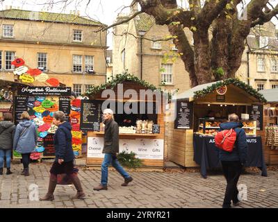 Street food stalls in Abbey Green at Bath Christmas Market, Bath, Somerset selling fish, cheese wine and other food and drink. Stock Photo