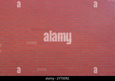 Red brick wall texture with grey cement filling Stock Photo