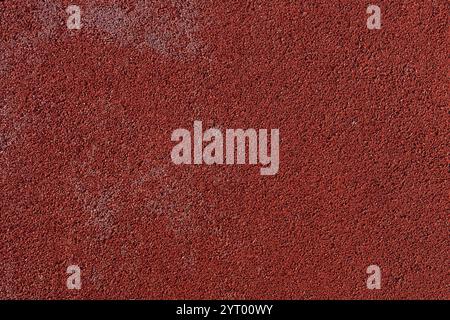 Close up of red rubber floor. Outdoor decoration. Sports running trail Stock Photo