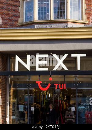 NEXT, Fashion store with TUI Concession, Cambridge, Cambridgeshire, England, UK, GB. Stock Photo