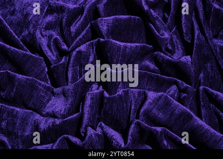 Abstract mystical background in dark blue. chic soft folds of factory velvet fabric. Luxury interior fabric for design. future dusk. Stock Photo