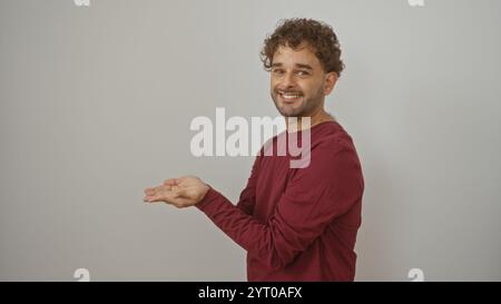 Handsome young hispanic man smiling wearing casual clothing standing isolated against white background Stock Photo