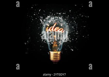 Creative idea light bulb with Idea explodes with shards of glass on a dark background. Business, ideas and new thinking. Think Different. Go beyond wh Stock Photo