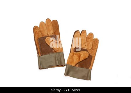 A pair of brown leather work gloves on a white background with copy space Stock Photo