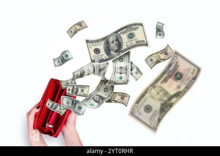 Female hands holding a red wallet and dollars flying, creative idea. Inflation and crisis, concept. Waste of money. Purchases. Money is flying away Stock Photo