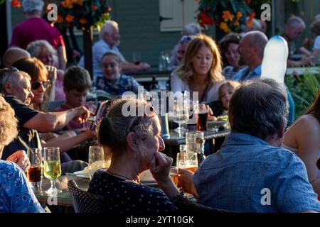 The Rendham Mummers play at the Sibton White Horse in rural Suffolk a comedy drama wearing traditional blackface and in an amusingly chaotic way Stock Photo