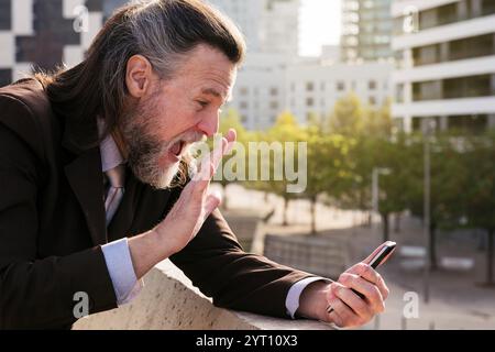 man greeting partner during video call on phone Stock Photo