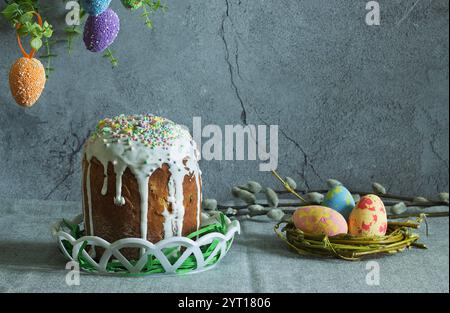 easter cake with painted eggs, sugar icing and willow branches Stock Photo