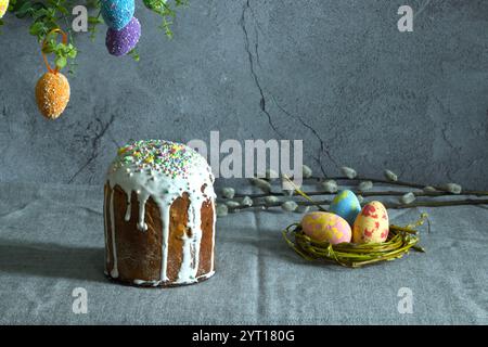 easter cake with painted eggs, sugar icing and willow branches Stock Photo