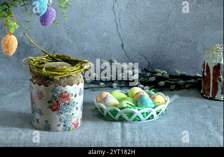 easter cake with painted eggs, sugar icing and willow branches Stock Photo