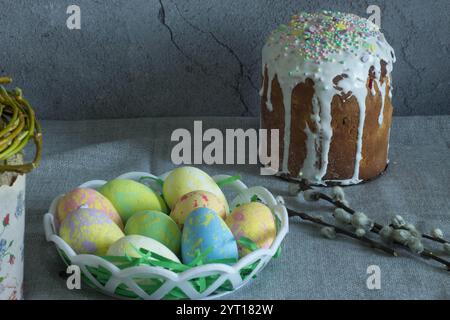 easter cake with painted eggs, sugar icing and willow branches Stock Photo