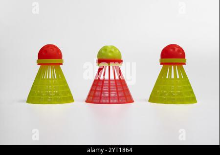 three shuttlecocks for playing crossminton on a white background. Stock Photo