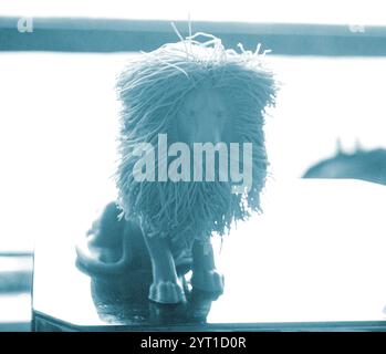 Art object lion printed on 3D printer. Abstract small toy model purple lion created on 3d printer. FDM 3D Printing technology. Concept new 3D Printing. Additive modern new progressive technologies Stock Photo