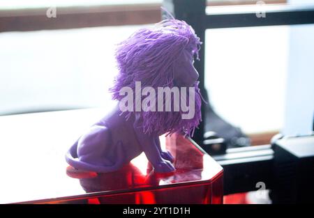 Art object blue lion printed on 3D printer. Abstract small toy model blue lion created on 3d printer. FDM 3D Printing technology. Concept new 3D Printing. Additive modern new progressive technologies Stock Photo