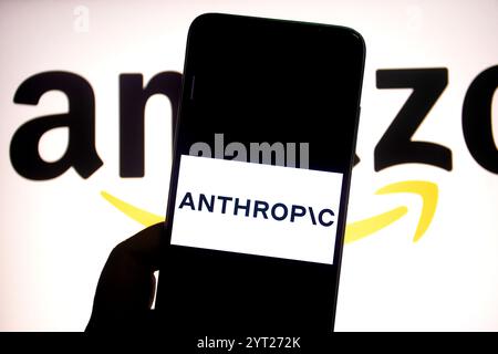 In this photo illustration, an Anthropic AI logo is seen displayed on a smartphone with an Amazon logo in the background. Stock Photo