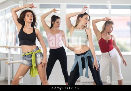 Group of modern women practicing high heels dance in studio Stock Photo