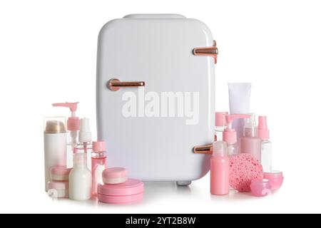 Small cosmetic refrigerator and cosmetic products on white background Stock Photo