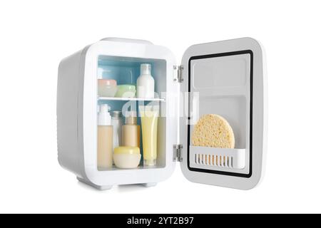 Small cosmetic refrigerator with cosmetic products on white background Stock Photo