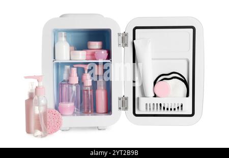 Small cosmetic refrigerator with cosmetic products on white background Stock Photo