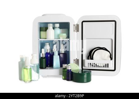 Small cosmetic refrigerator with cosmetic products on white background Stock Photo