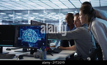 Engineer calling colleagues after finding error in code while doing checkup on server room used for AI workloads. Man requesting help from coworkers after finding bug in data center systems, camera B Stock Photo