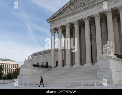 Washington DC - October 27, 2024: Person walks in front of the Supreme Court of the United States. Washington DC, USA. Stock Photo