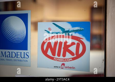 BELGRADE, SERBIA - OCTOBER 12, 2024: Niki airline logo sticker on a window of a travel agent. Part of Airberlin, niki was a low cost airline, now bank Stock Photo